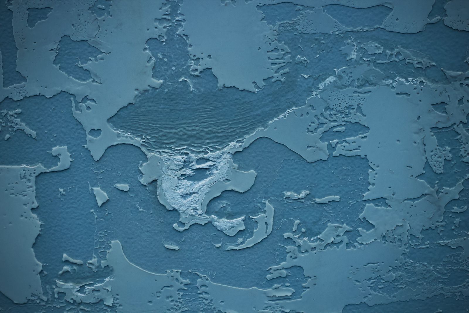 Close-up of a textured blue coating surface
